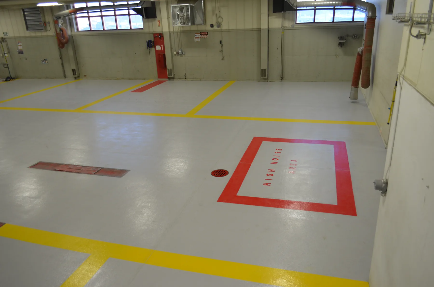 Warehouse floor with fresh yellow safety striping
