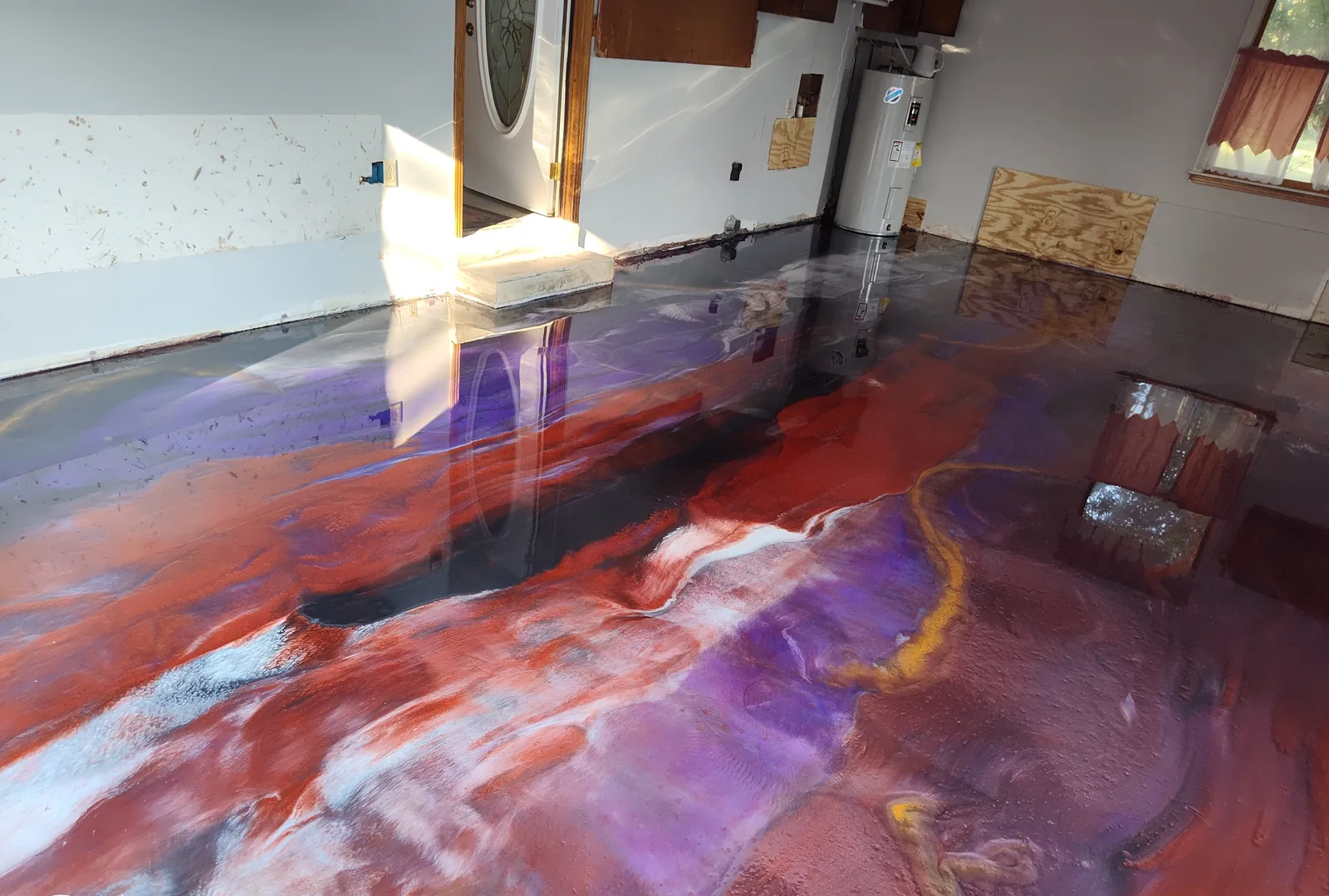Red and purple metallic epoxy pour in a residence