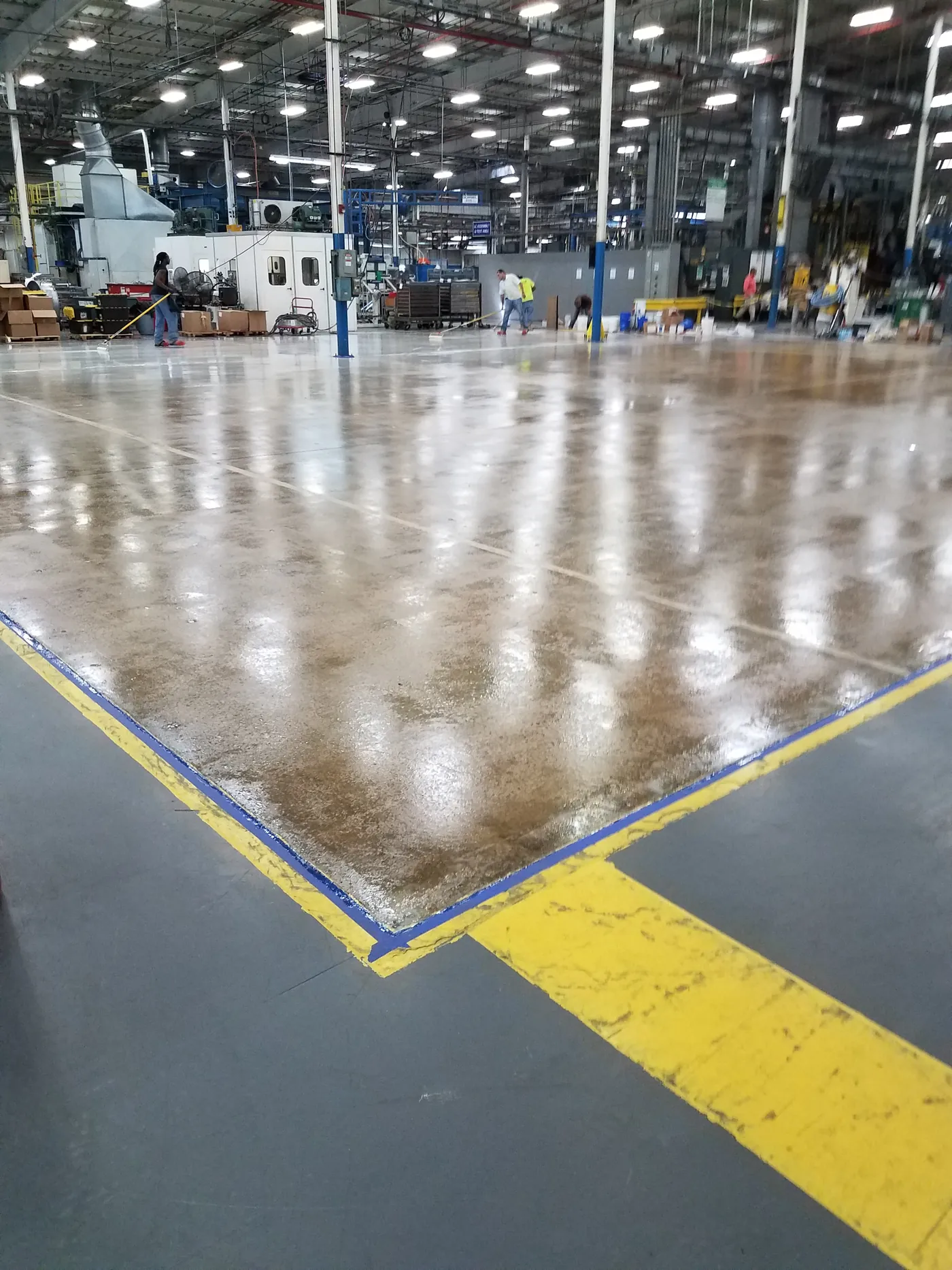 Plant floor with yellow line striping and racking