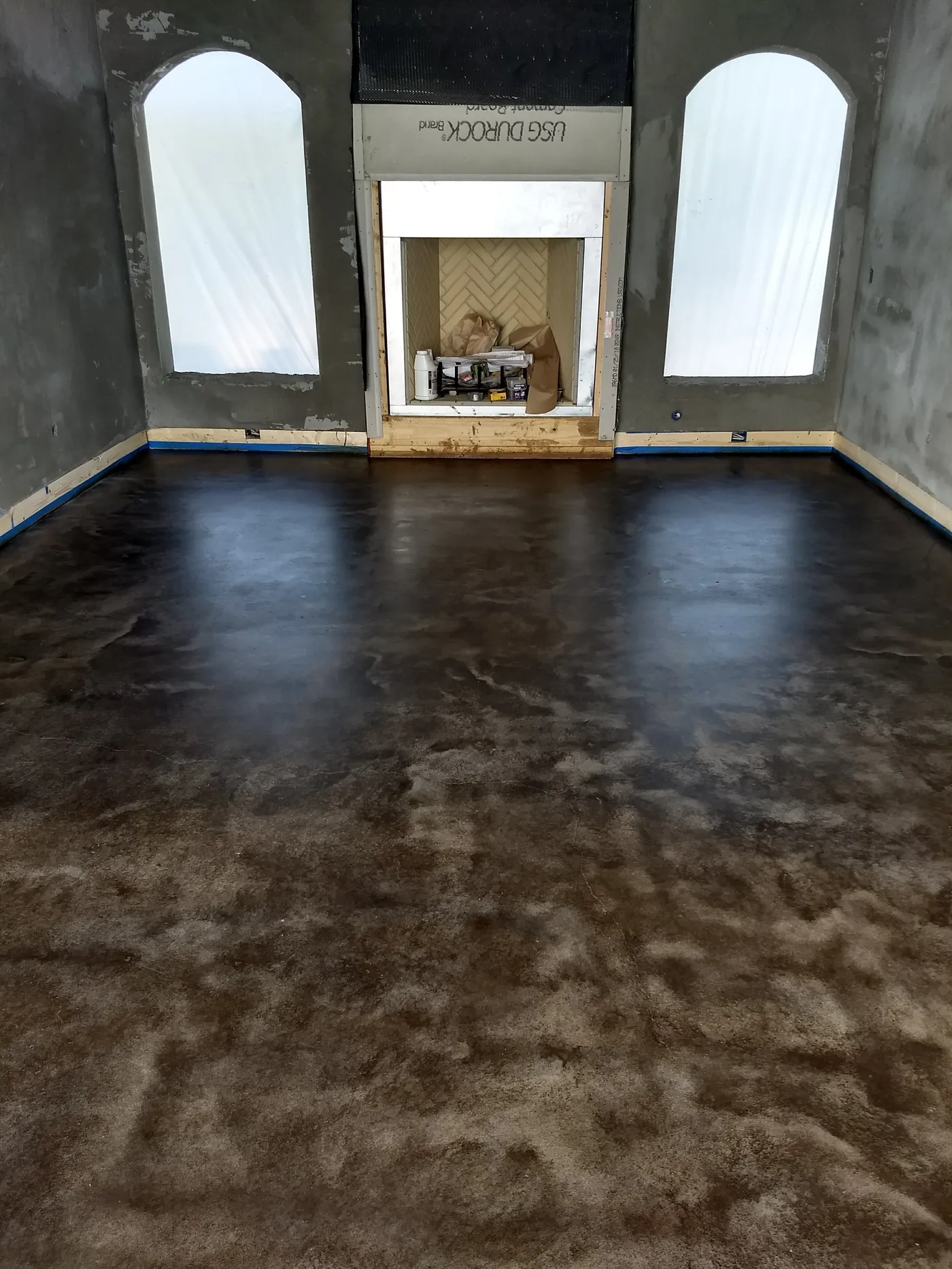 Charcoal stained concrete with mottled finish